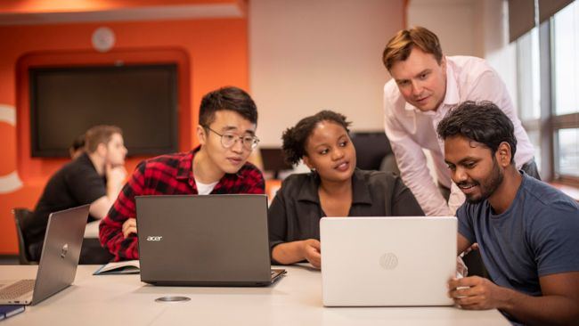 Students with a laptop