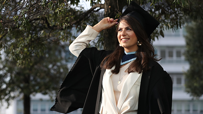 Female graduate in her robes